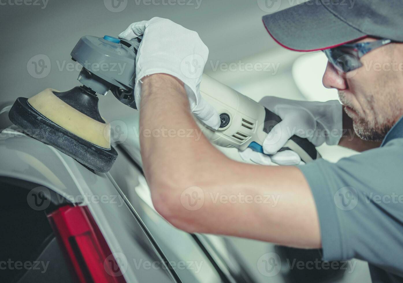 Collision Center Worker Polishing Car Body photo