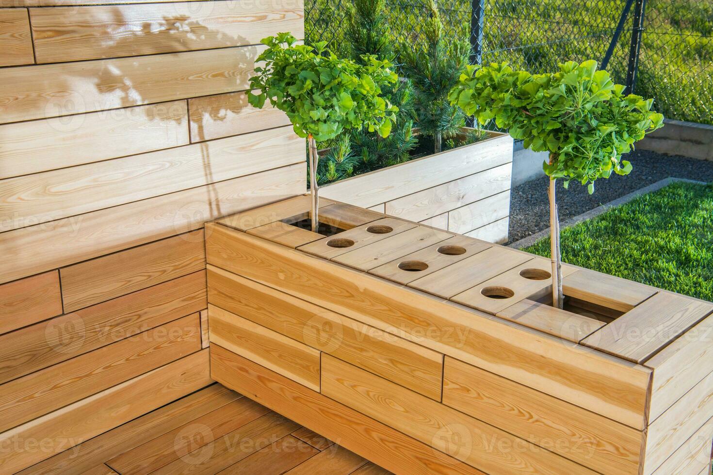 Outdoor Wooden Patio Area With Plants. photo