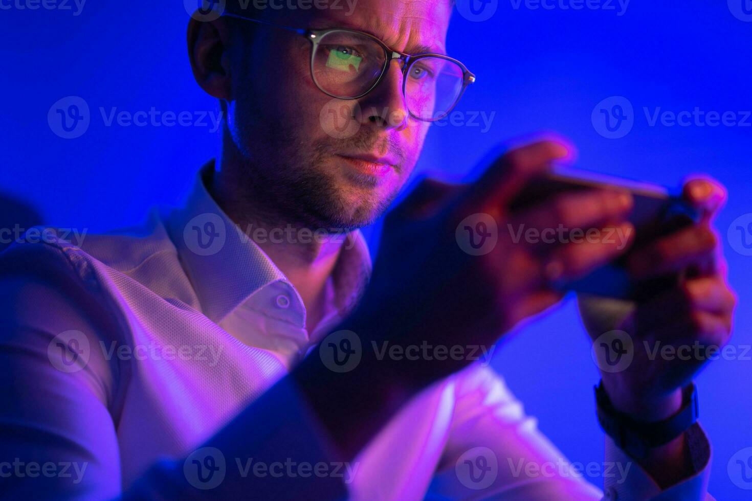 Businessman Looking at His Phone Screen photo