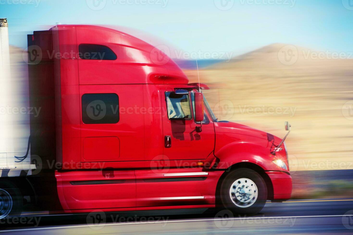 Red Semi Truck on the Road photo