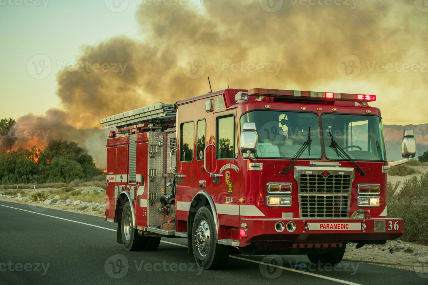 Riverside County Firetruck on the Side of the Road with Wildfire photo