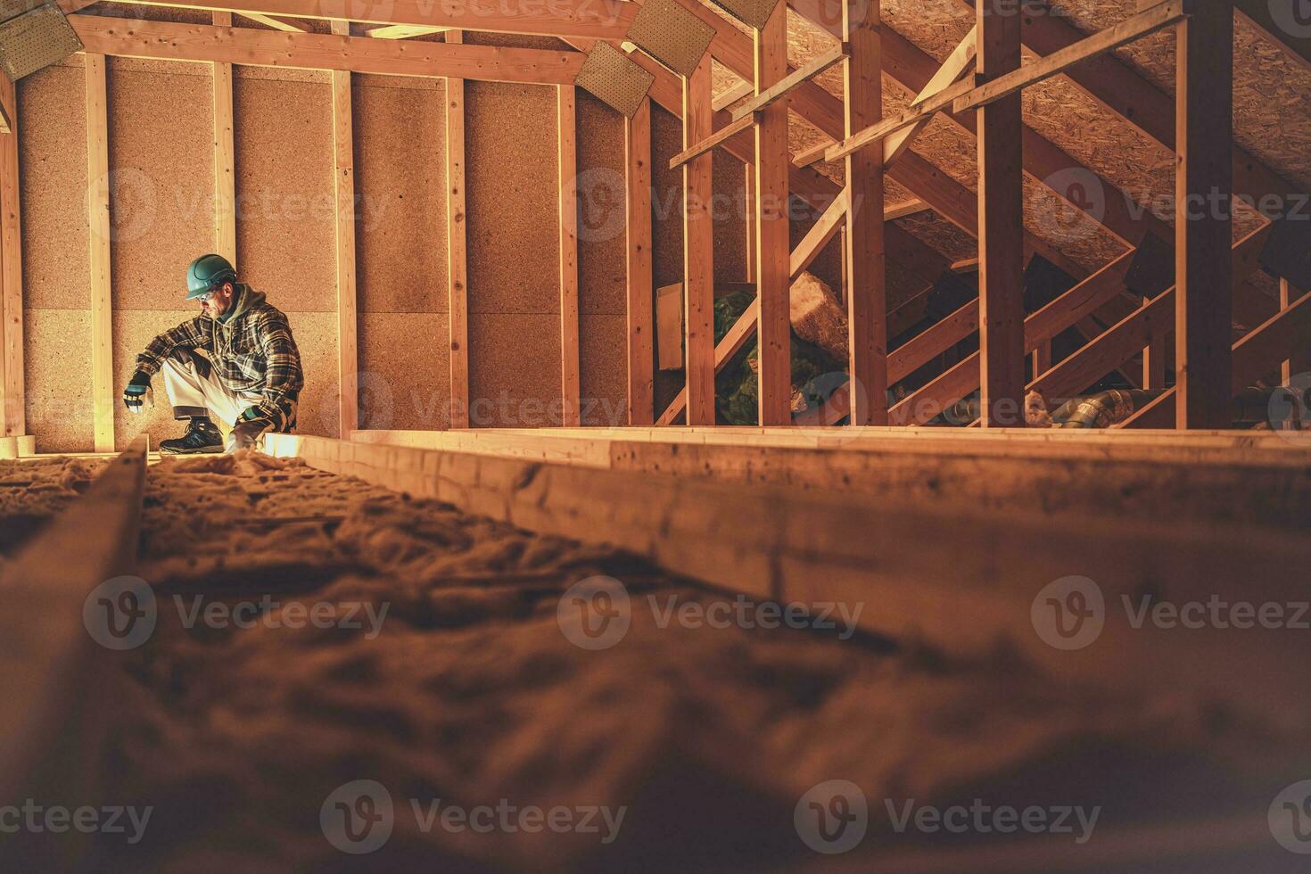Construction Worker and the Wooden House Attic photo
