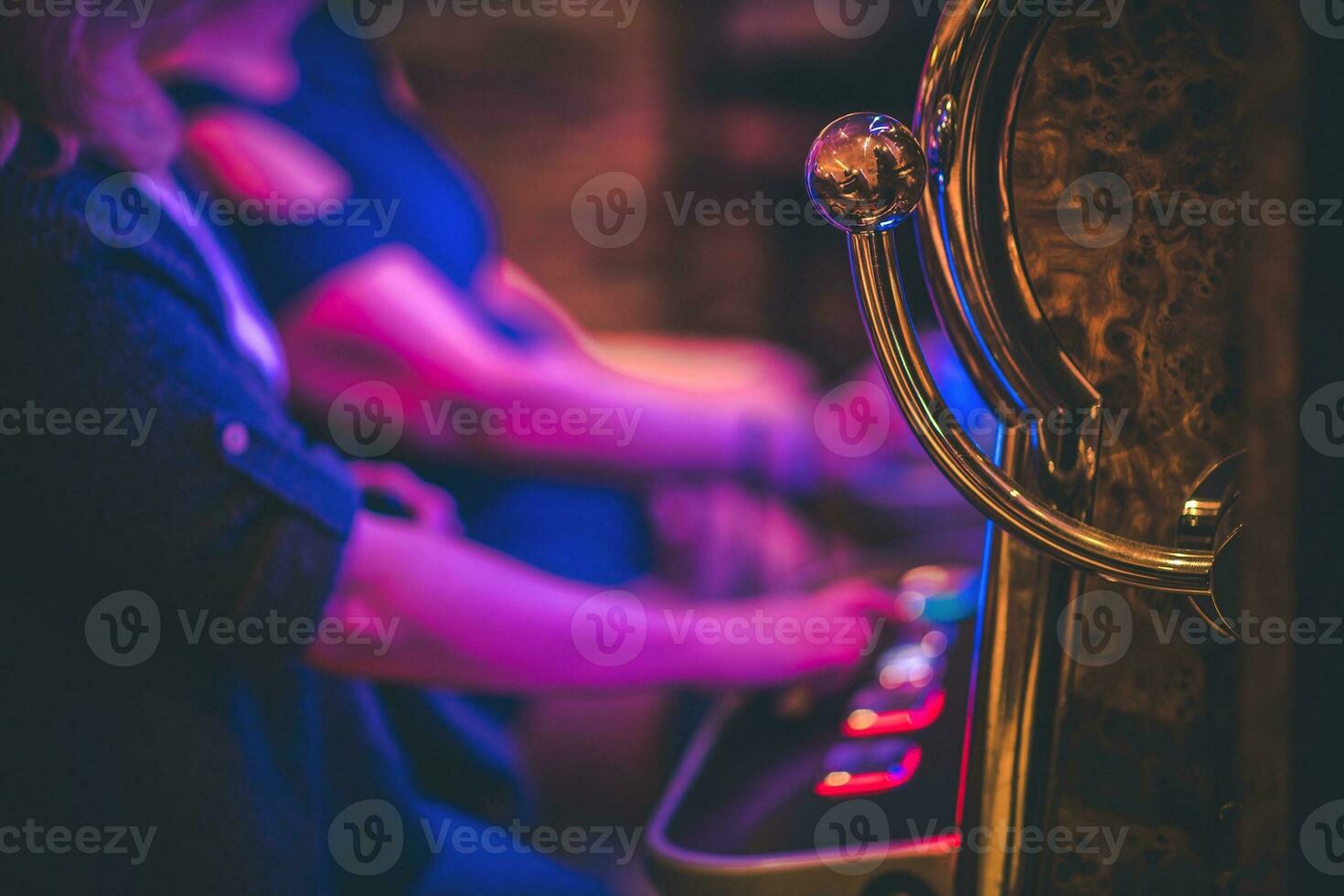 People Playing Slot Machines photo