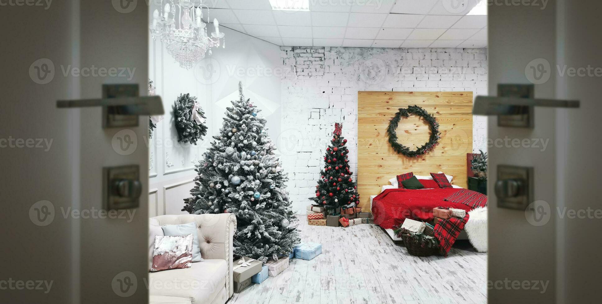 Christmas interior with a Christmas tree fireplace and open door photo