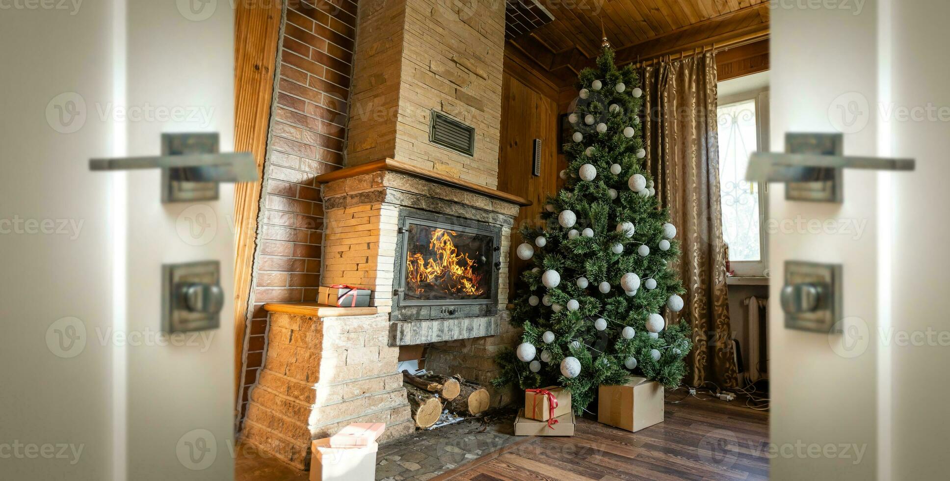 Christmas interior with a Christmas tree fireplace and open door photo