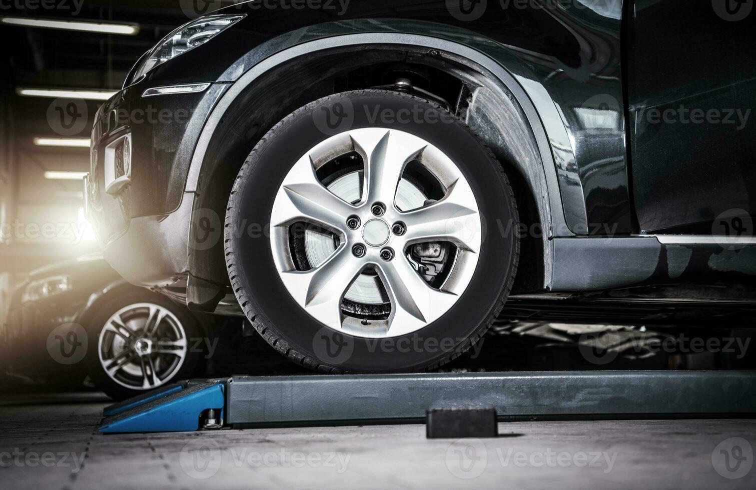 Broken Modern Vehicle in the Auto Service photo