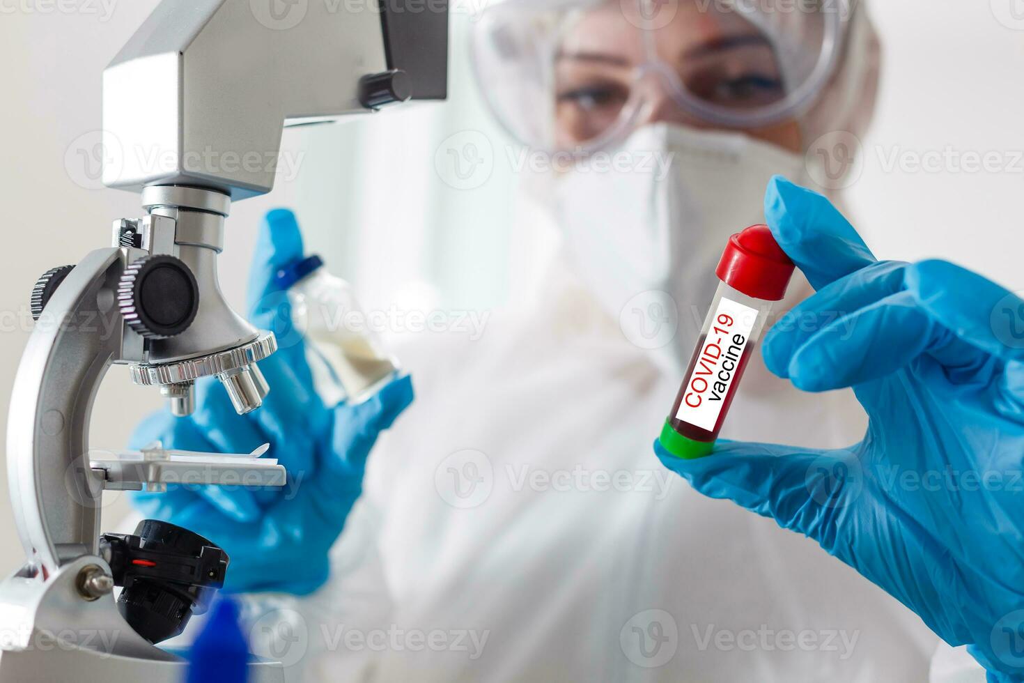 a man wearing a penis holding a covid 19 vaccine photo