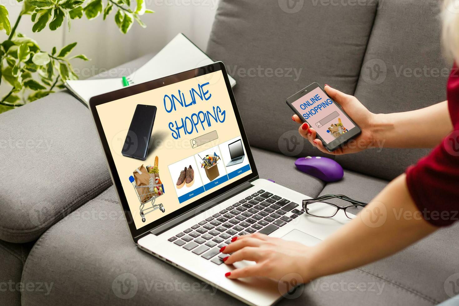 shopping, technology and internet concept young girl shopping with laptop computer on a fictional shop photo