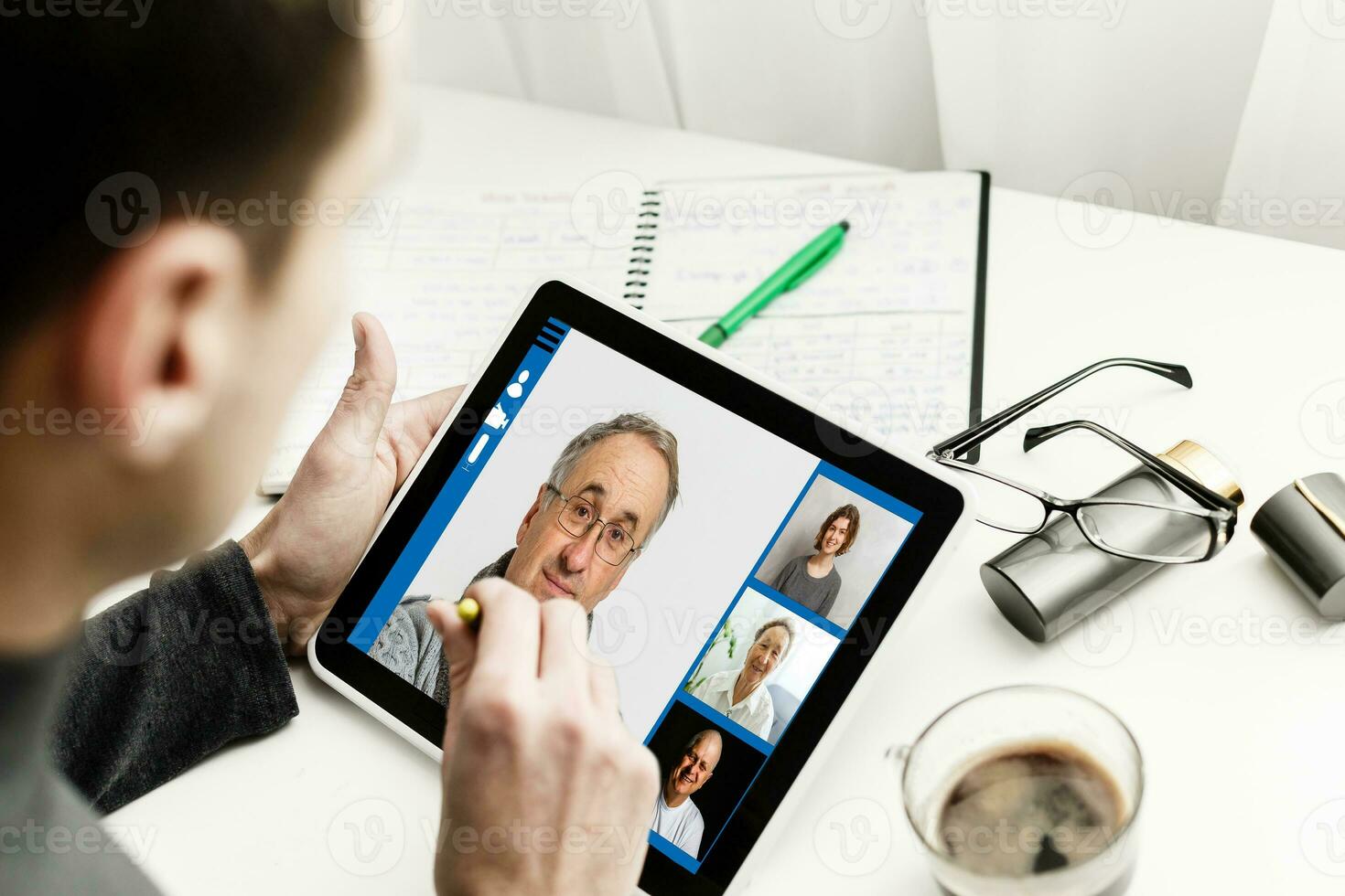 Cropped image of cheerful blogger having funny conversation with best friend in video chat on modern touchpad connecting to wireless 4G internet.Young man sharing impressions of trip on webcam photo