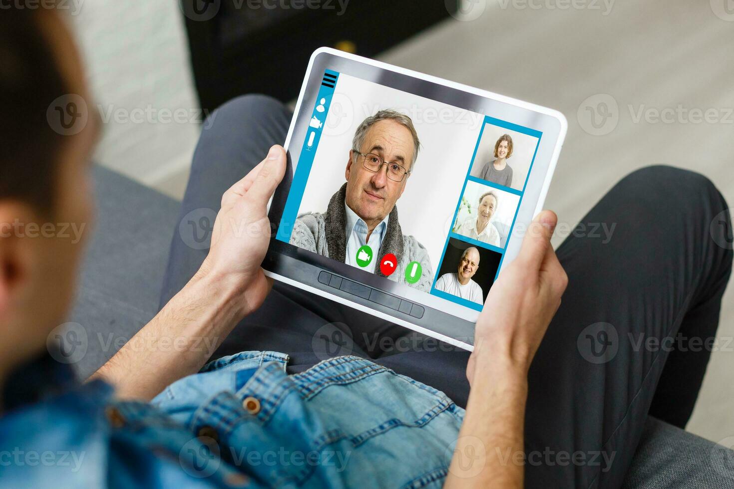 Cropped image of cheerful blogger having funny conversation with best friend in video chat on modern touchpad connecting to wireless 4G internet.Young man sharing impressions of trip on webcam photo