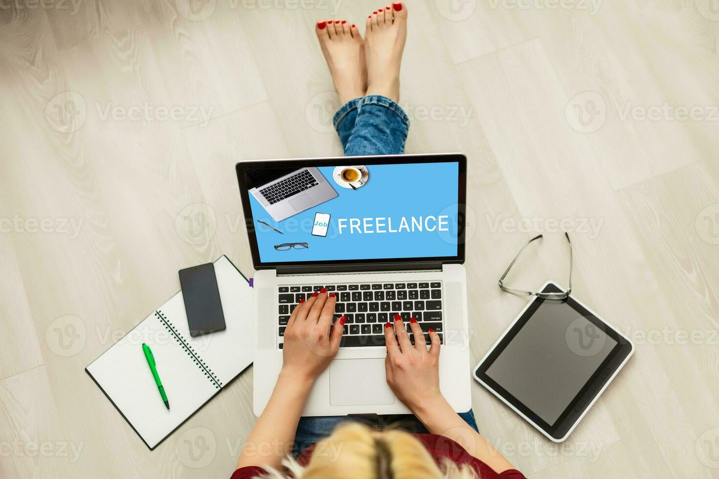 Top view young female freelancer busy working on laptop computer while sitting on the floor, charming business woman working from home , young student photo