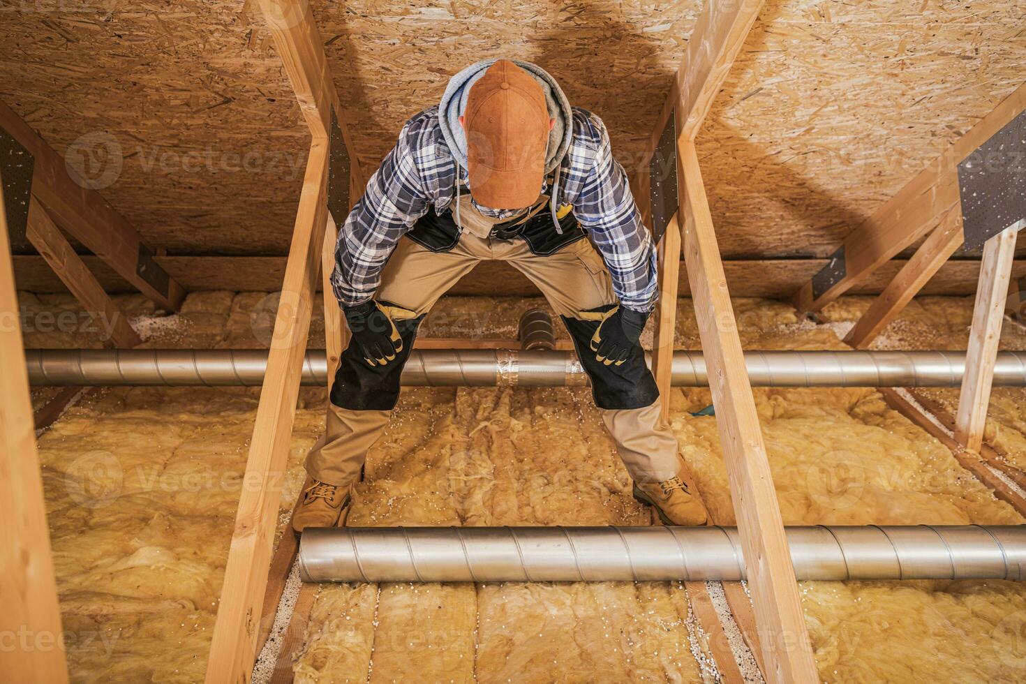 Duct Specialist Installing Air Vent System. photo