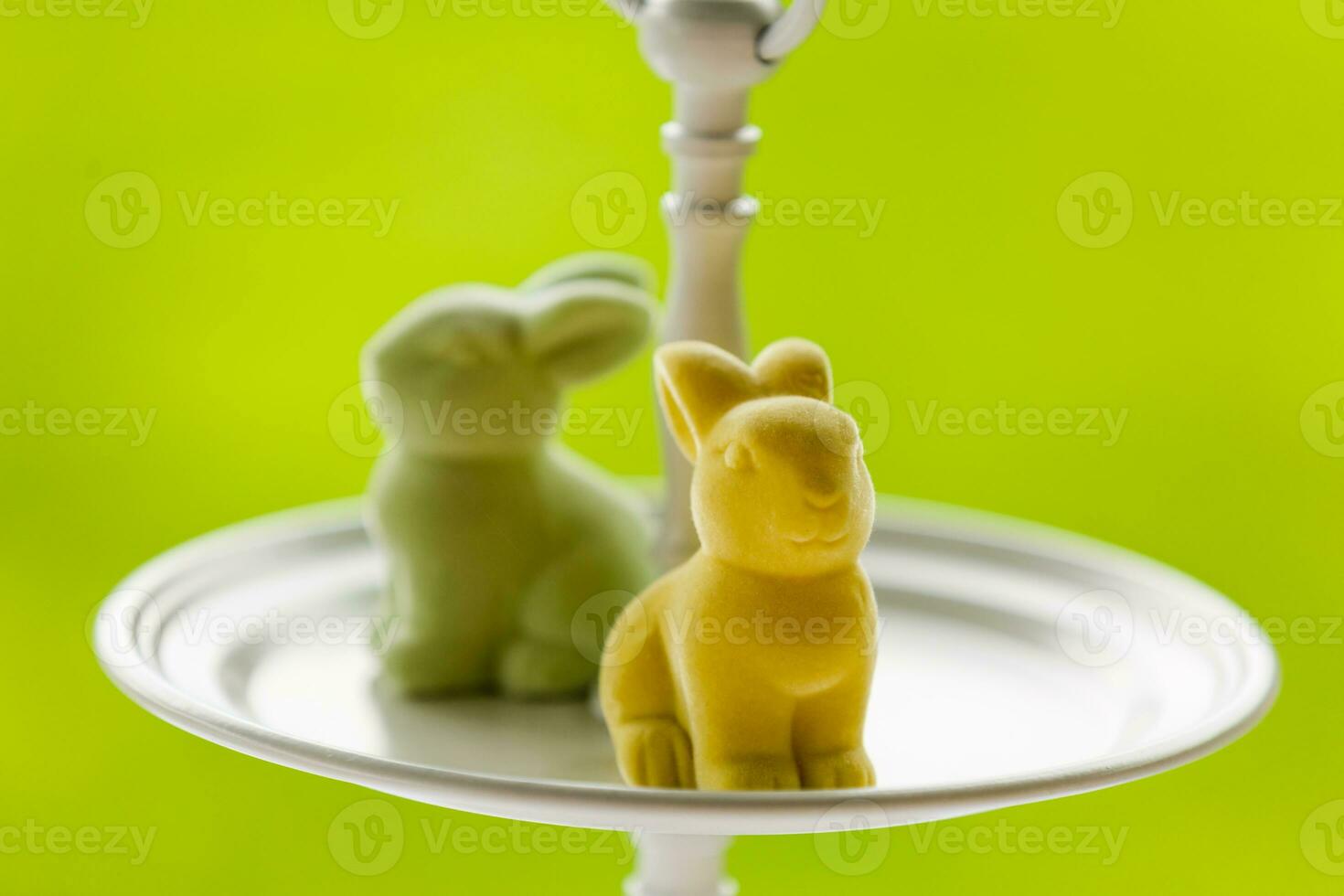 Easter decoration with sugar rabbits,eggs and flowers. photo