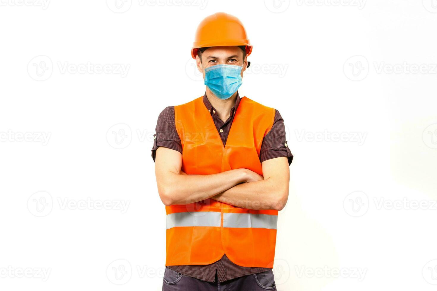 Worker in protective workwear with tools, isolated photo