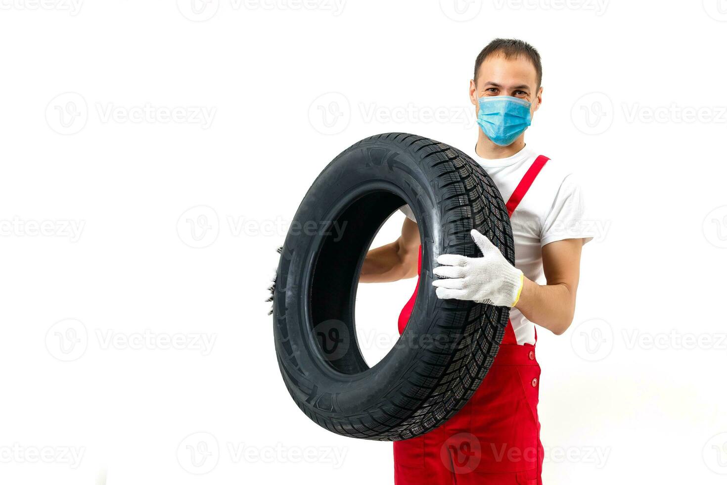 tireman in protective mask, wearing face protection in prevention for coronavirus. COVID-19 Pandemic Coronavirus photo