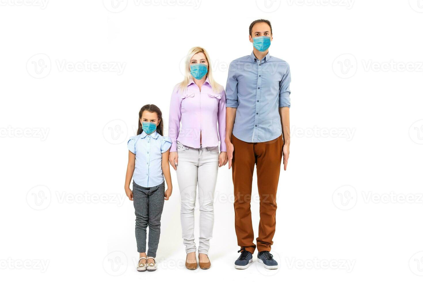 family in protective masks quarantined. Normal life with coronavirus. Lifestyle COVID-19. Quarantine virus protection sterility home together heart symbol photo