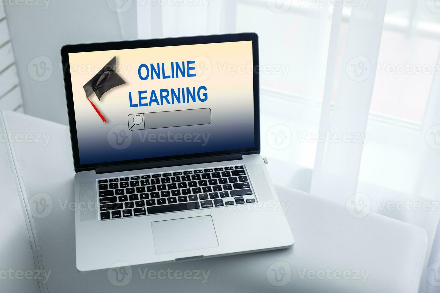 Open laptop with screen with text ONLINE LEARNING photo