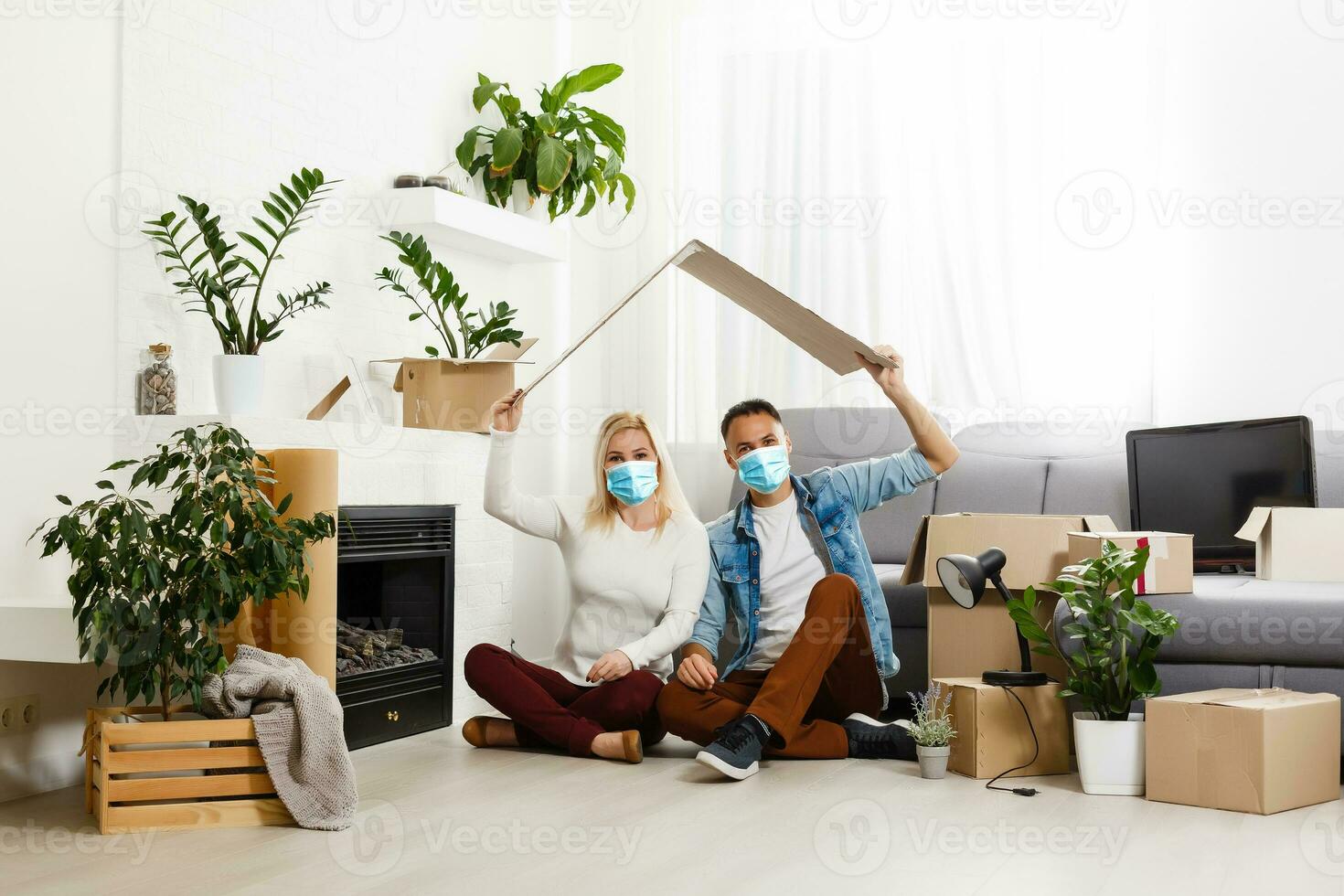 husband and wife in protective mask. Coronavirus. COVID-19. A quarantine at home. photo