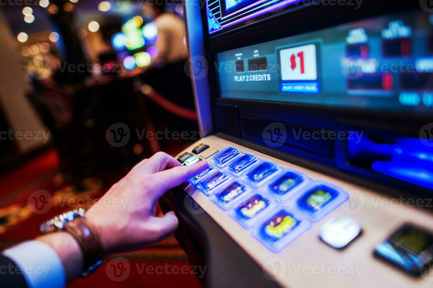 Men Playing Slot Machine photo