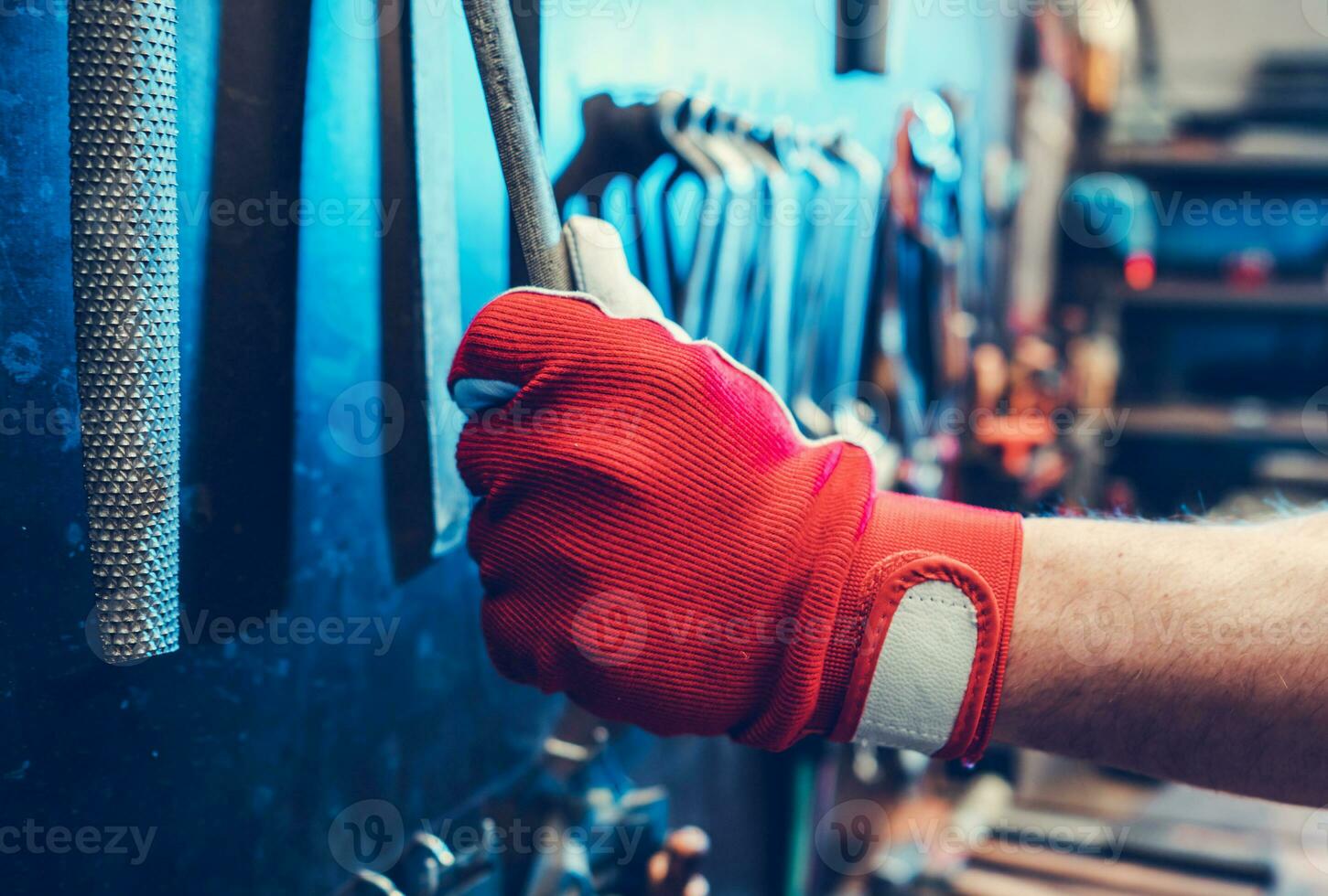 Worker Taking Metal File Tool photo