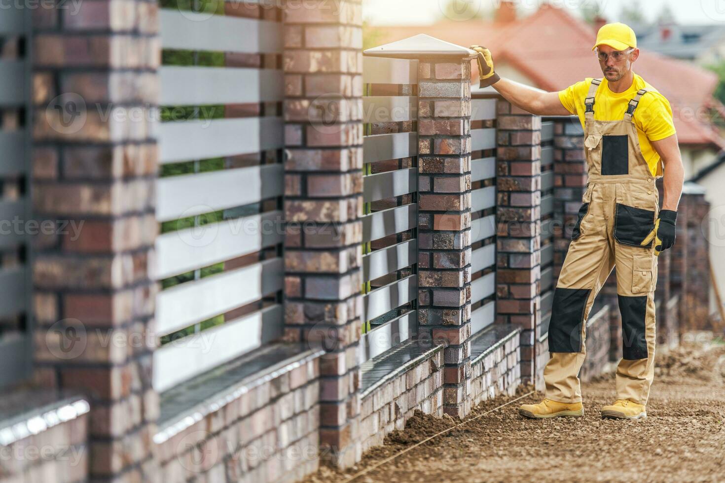 Bricks and Aluminium Panels Made Residential Fence photo
