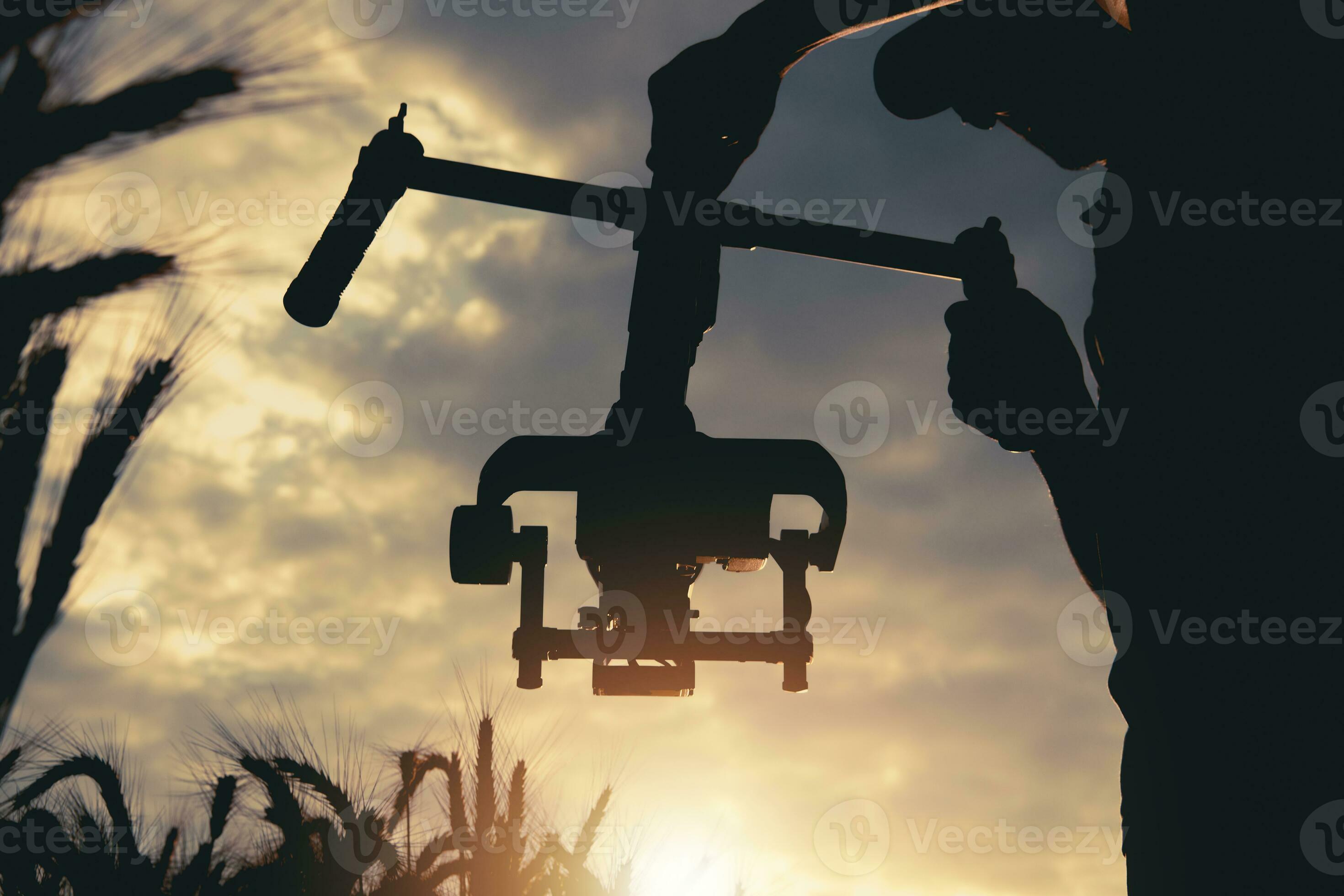 Handheld Video Camera Professional Stabilizator in Use While Taking