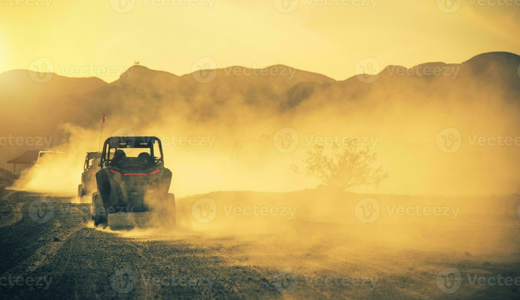 Side by Side ROV Recreational Off Highway Vehicles on a Desert Road photo