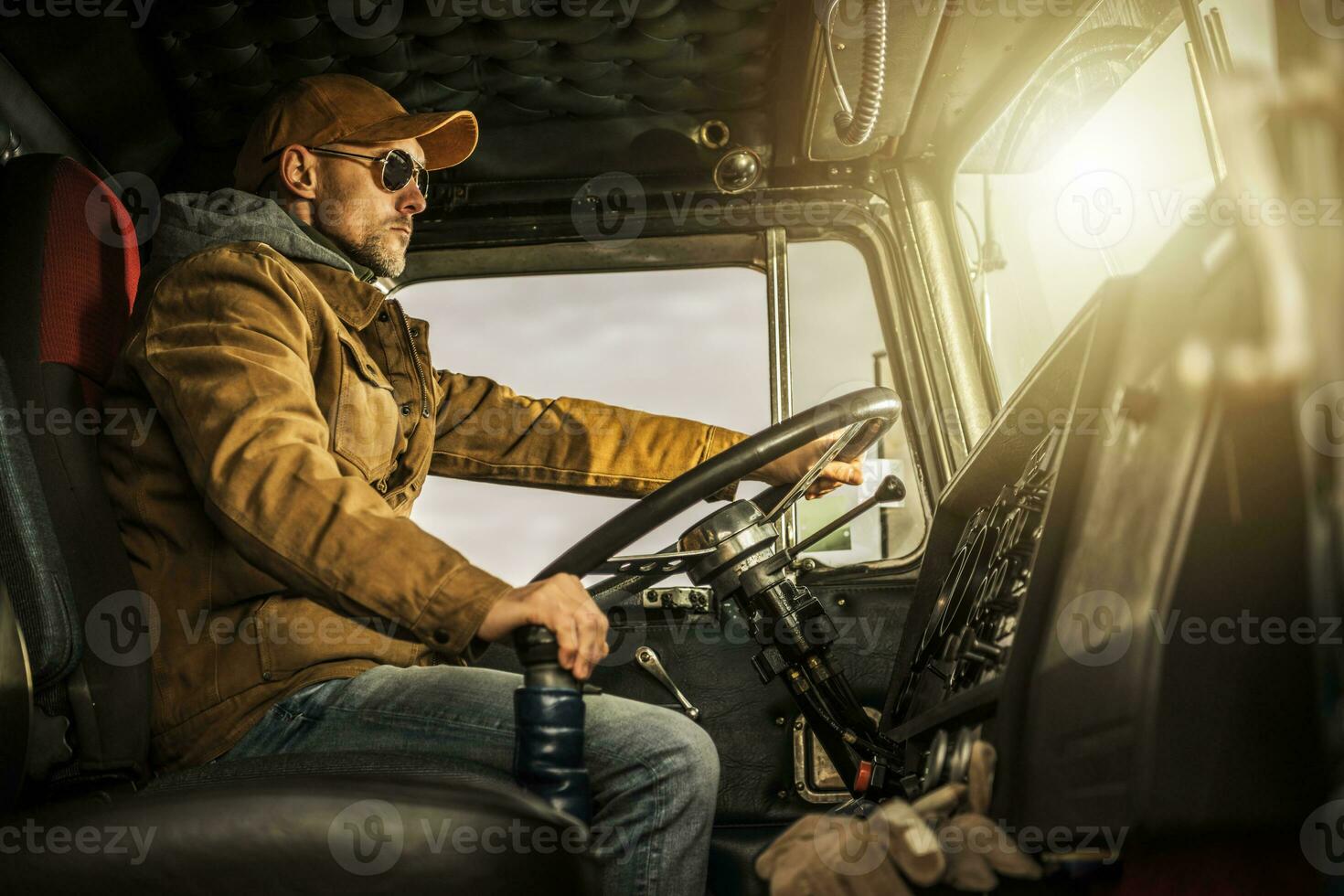 Professional Semi Truck Driver Behind the Wheel photo