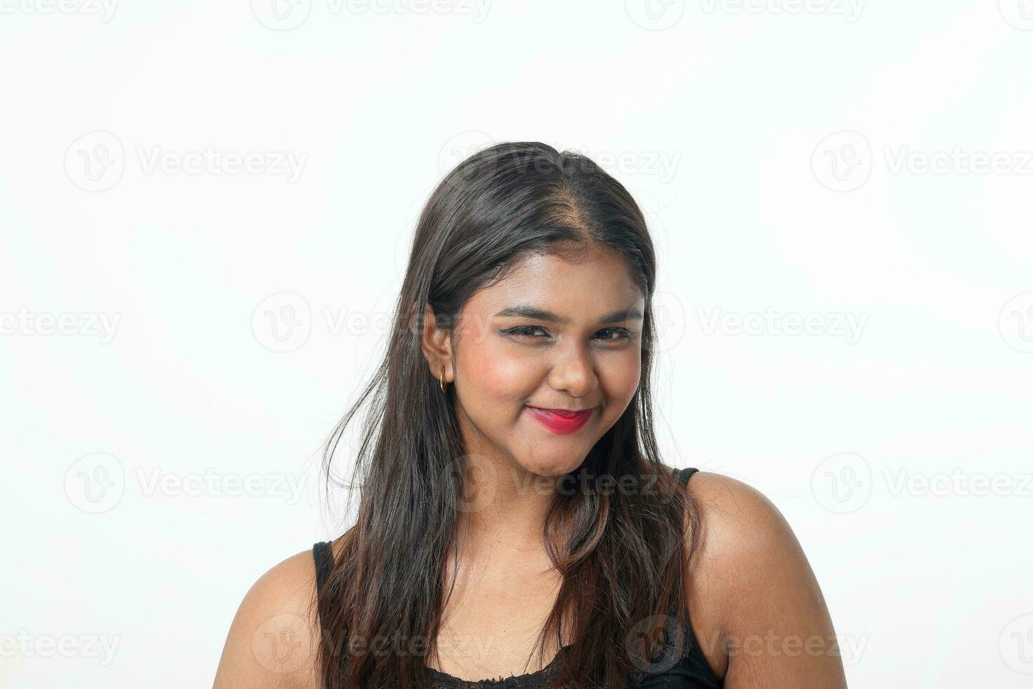 Young attractive Asian Indian woman pose face body expression mode emotion on white background witty pretty sexy funny smile photo