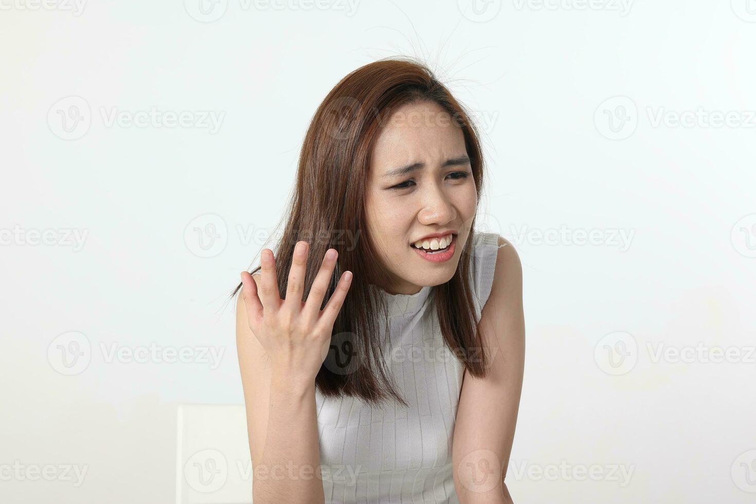 Young attractive Asian chinese malay woman pose face body expression mode emotion on white background question what angry photo