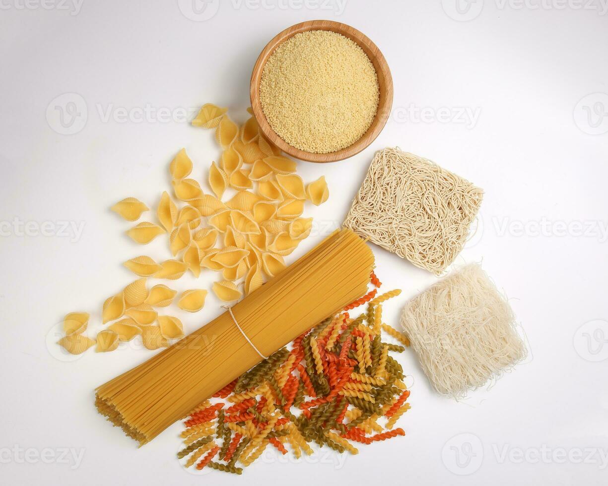 dry raw spaghetti conchiglie seashells fusilli cork screw color pasta couscous wheat rice noodles beehoon verity on white background photo
