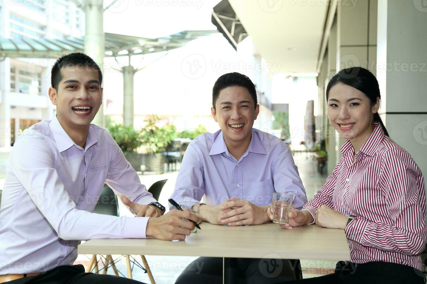 Young south east Asian middle eastern man woman business colleague outdoor stand pose photo