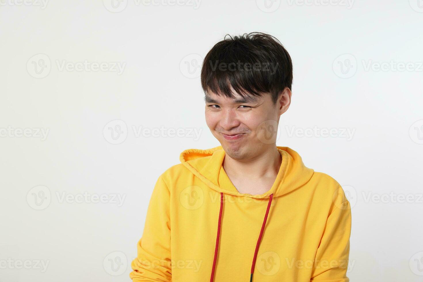 Young good looking Asian chinese malay man pose face body expression mode emotion on white background witty funny smile photo