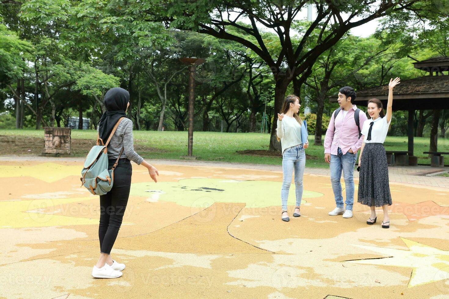 Young asian malay chinese man woman outdoor park  book file folder laptop computer phone sit stand study mingle photo