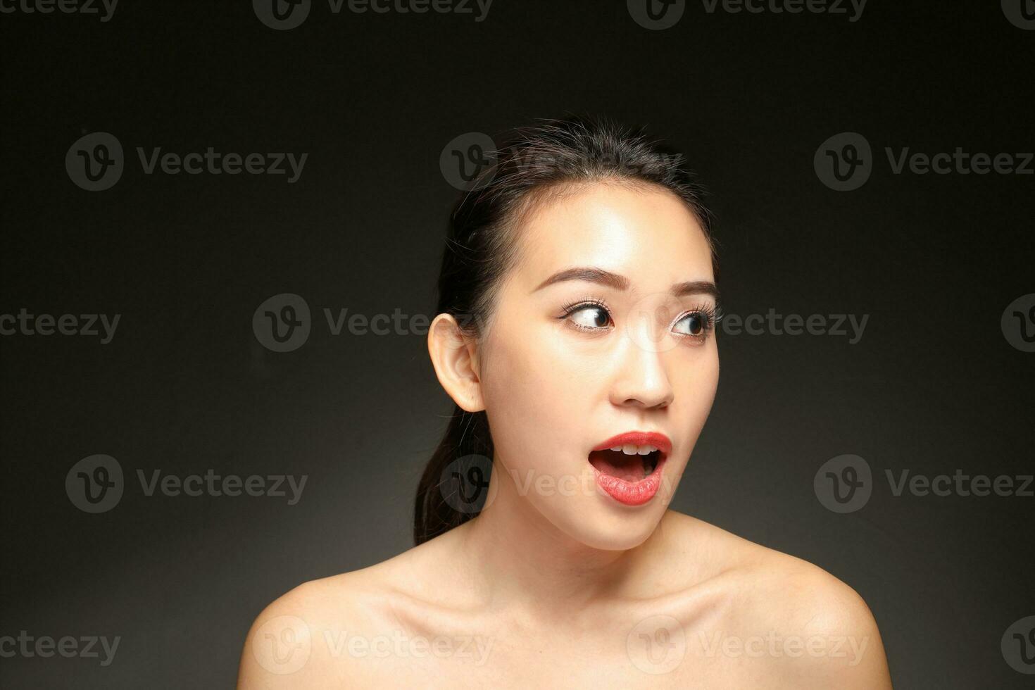 Young beautiful Asian woman facial expression photo