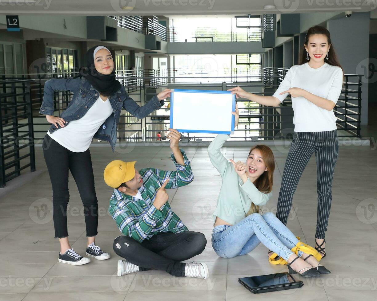 Young asian malay chinese man woman indoor stair corridor campus book file folder laptop computer phone sit stand study mingle copy text space whiteboard point show photo