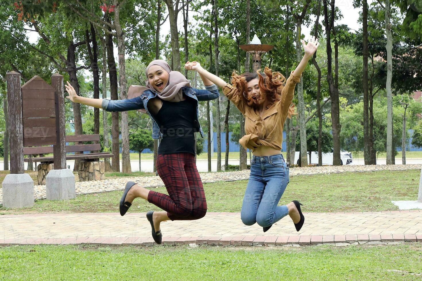 Young Asian different ethnic malay chinse  man woman activity lifestyle student educating job business jump in air photo