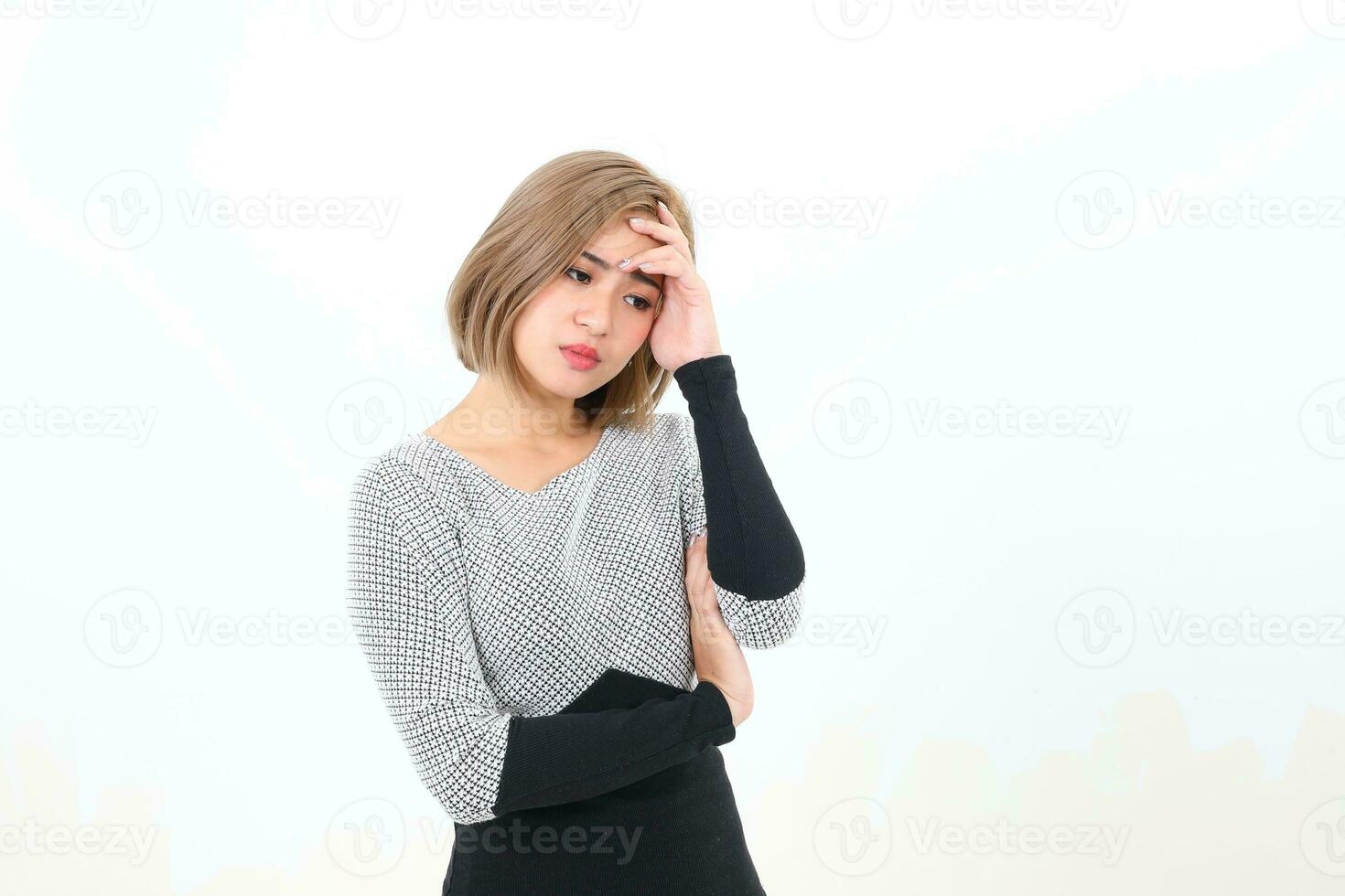 South east Asian Chinese Woman facial expression stand thinking worried hand on forehead photo