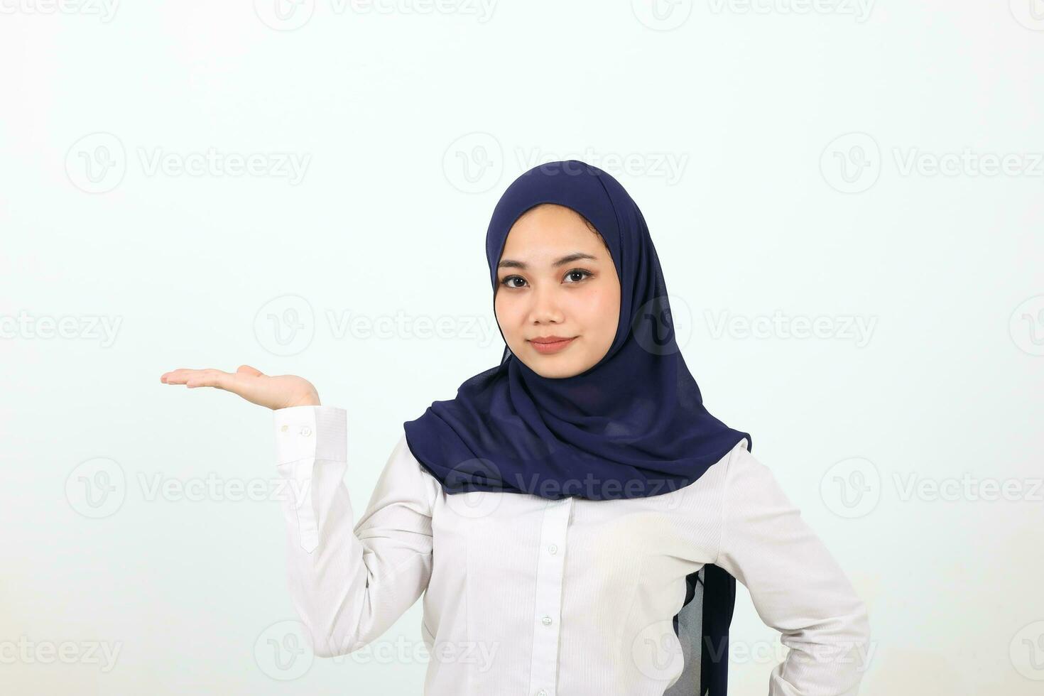 South east Asian Malay Woman headscarf facial expression show point palm of hand photo