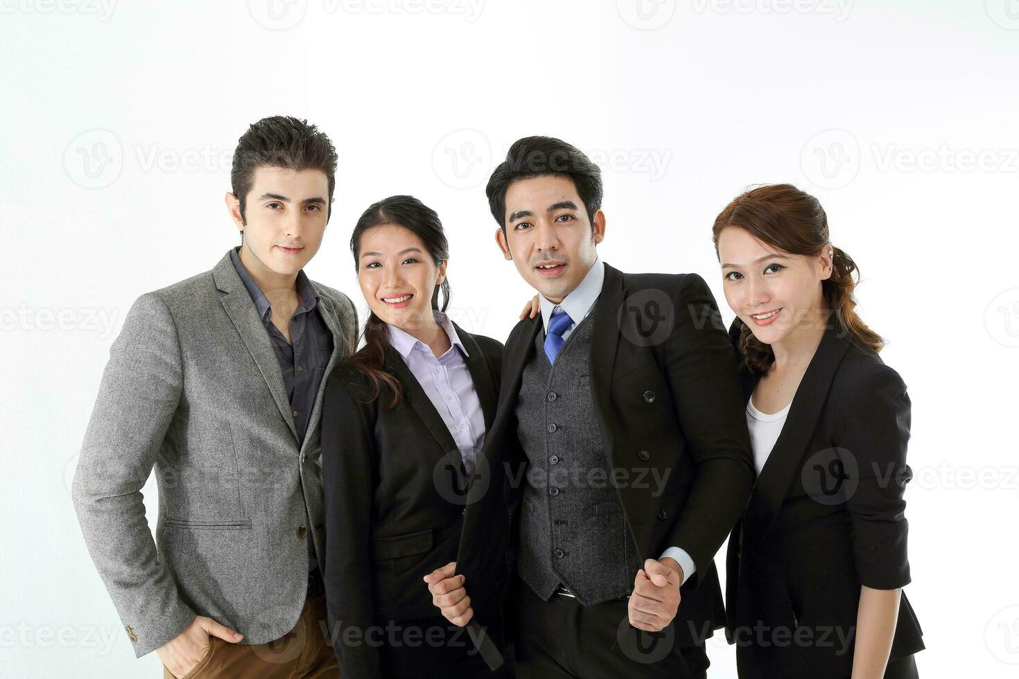 Southeast Asian middle eastern Caucasian young office business man woman wearing suit stand hand on shoulder unity togetherness confident happy success expression on white studio background photo