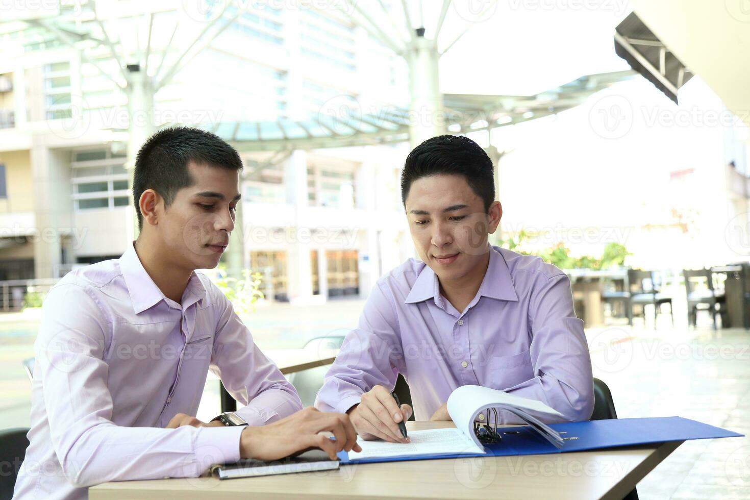Young south east Asian middle eastern man woman business colleague outdoor stand pose photo