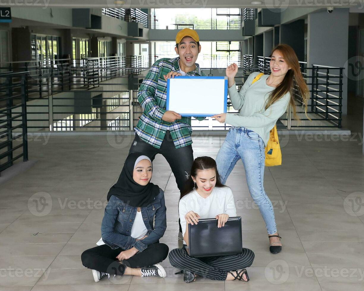 Young asian malay chinese man woman indoor stair corridor campus book file folder laptop computer phone sit stand study mingle copy text space whiteboard point show tug photo