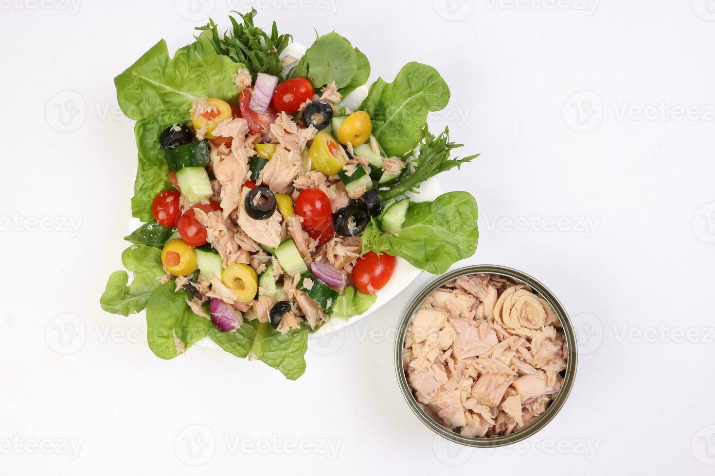 Tuna fish meat salad cucumber tomato onion black green olive leaf