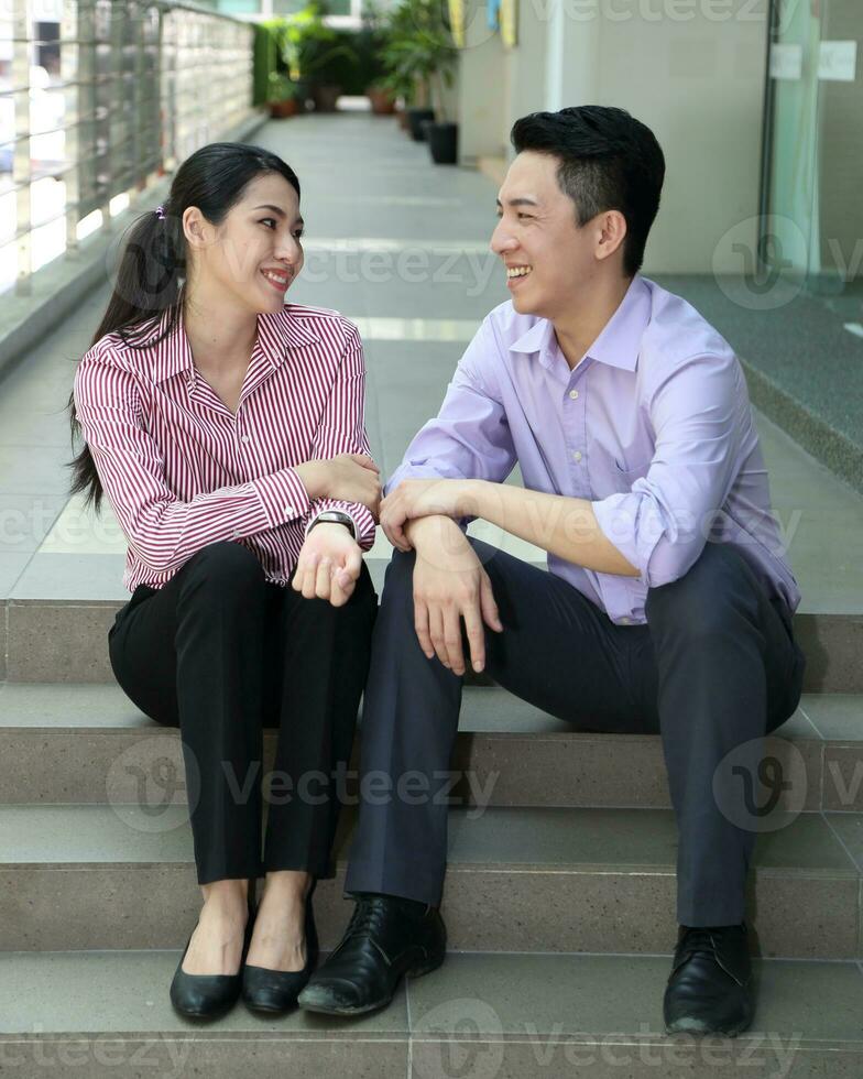 Young south east Asian middle eastern man woman business colleague outdoor stand pose photo