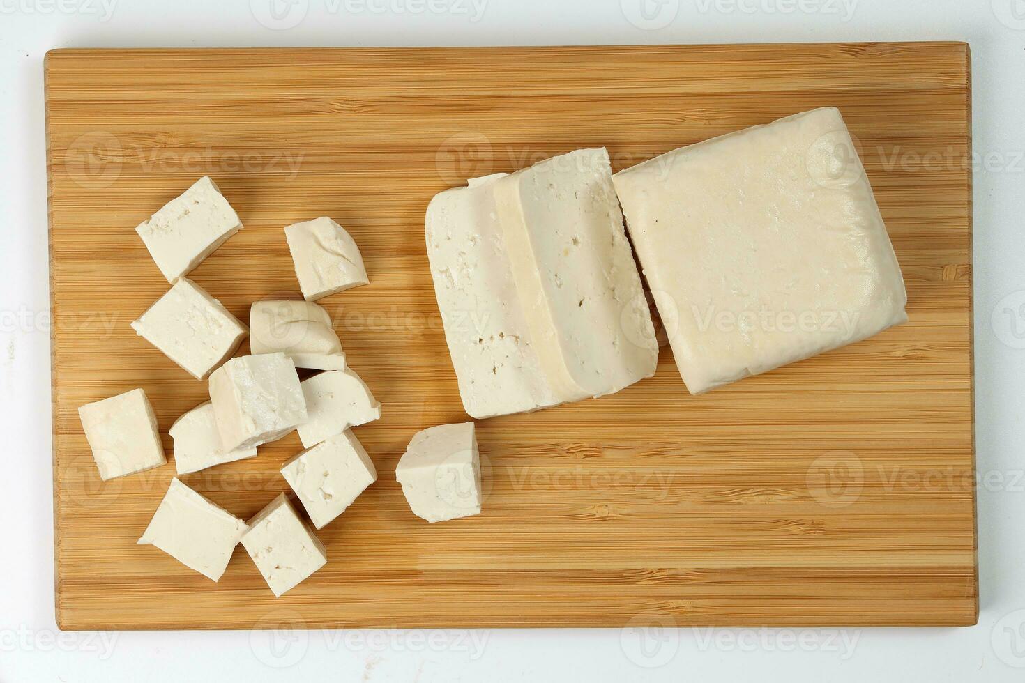 Soyabeans soya bean curd tofu wooden board block slice dice chopped photo