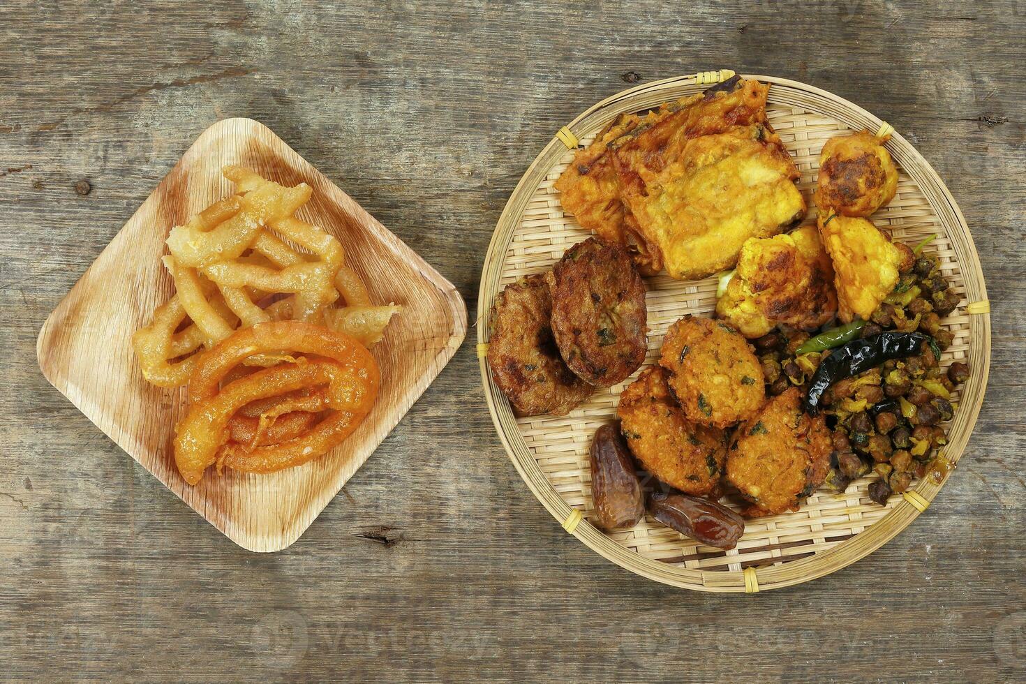 iftar set Piaju pakora beguni black chickpeas ghugni potato chop dates snack fried food photo