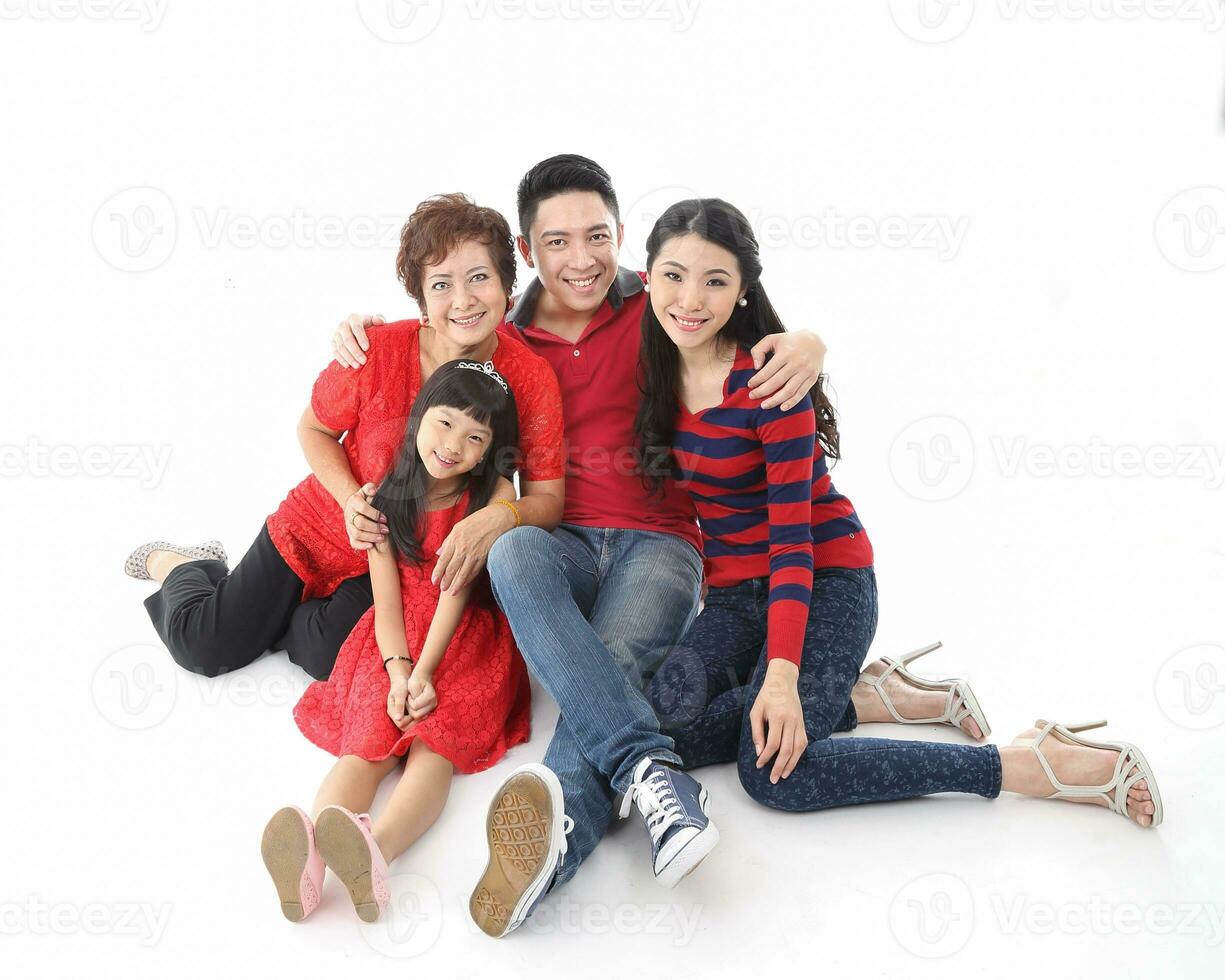 Southeast Asian multigeneration family parents daughter grandmother father mother child pose happy sit stand photo