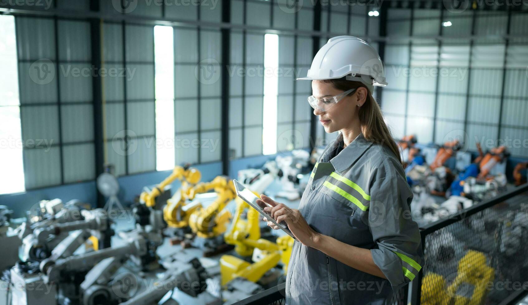 A female auditor Inspected to account for the company's robot assets that were brought to the warehouse before delivering to customers. photo