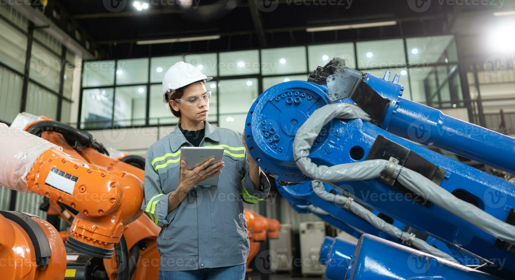 A female auditor Inspected to account for the company's robot assets that were brought to the warehouse before delivering to customers. photo