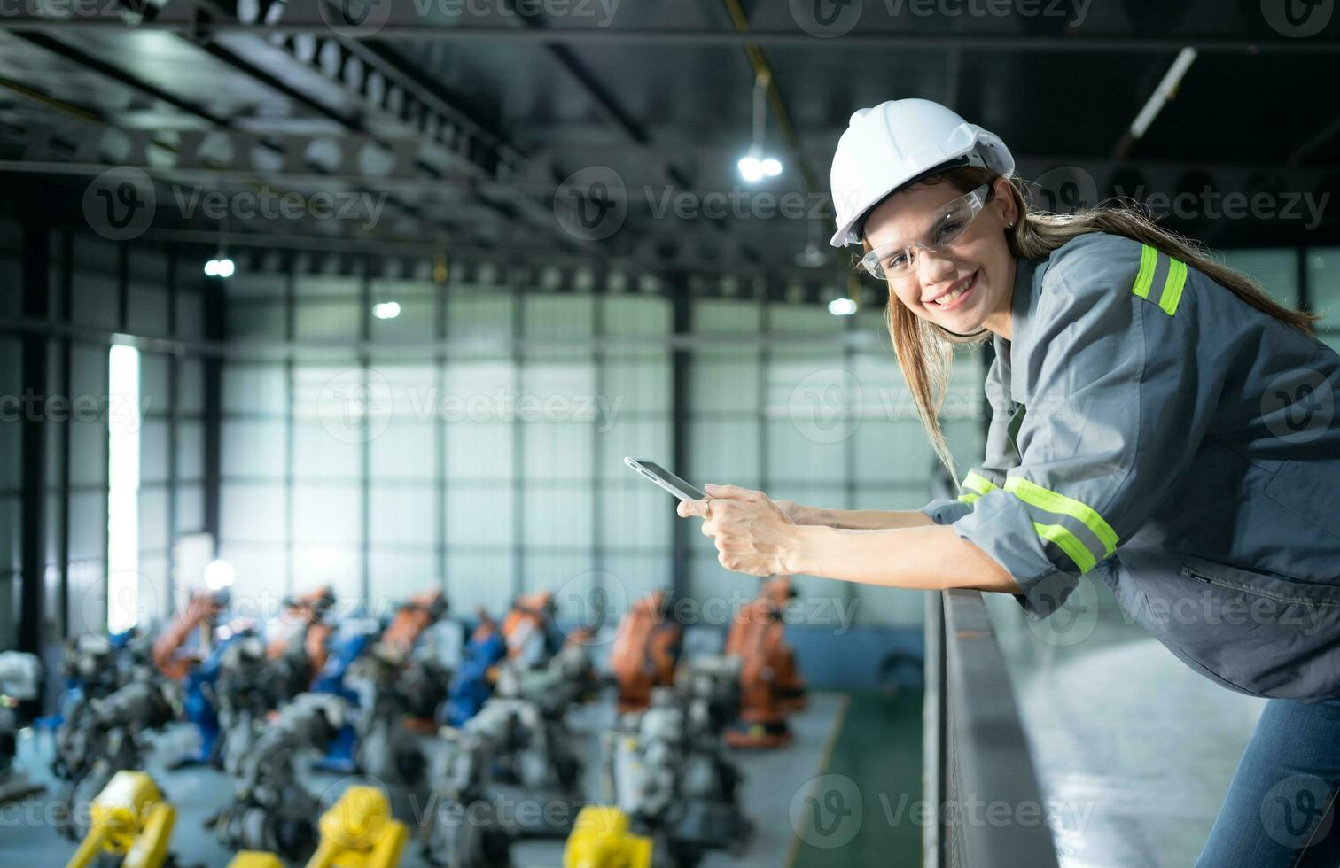 A female auditor Inspected to account for the company's robot assets that were brought to the warehouse before delivering to customers. photo